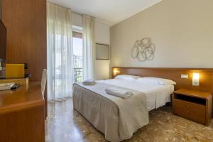 Postel nebo postele na pokoji v ubytování B&B Mariclà