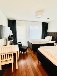 Postel nebo postele na pokoji v ubytování Continental Apartment Hotel Sollentuna