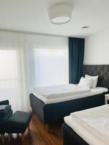 Postel nebo postele na pokoji v ubytování Continental Apartment Hotel Sollentuna