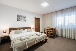 Postel nebo postele na pokoji v ubytování Residence Malva