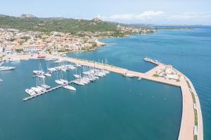 an aerial view of a marina with boats in the water at La Sciumara with beach access - Happy Rentals in Cannigione