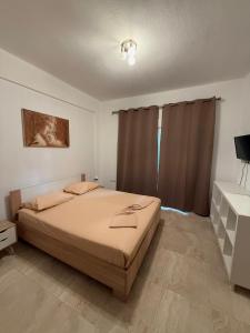 Postel nebo postele na pokoji v ubytování Villa Spartandom