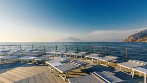 a group of chairs and tables on a cruise ship at Palazzo Murrano - Adults Only in Vico Equense