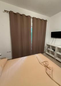 Postel nebo postele na pokoji v ubytování Villa Spartandom