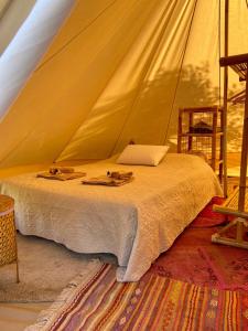 Postel nebo postele na pokoji v ubytování Bellissima Bell tent