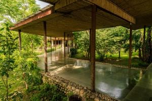 an external view of a house with a pavilion at Sanctuary Chitwan National Park in Chitwan
