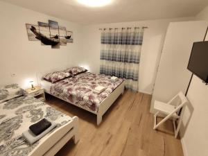 Posteľ alebo postele v izbe v ubytovaní Guesthouse Eljuga Family