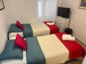 Postel nebo postele na pokoji v ubytování Damira Rooms