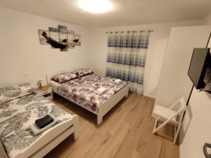 Posteľ alebo postele v izbe v ubytovaní Guesthouse Eljuga Family
