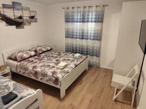 Posteľ alebo postele v izbe v ubytovaní Guesthouse Eljuga Family