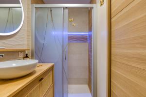 a bathroom with a sink and a shower at Sunshine in La Grande-Motte +16 photos