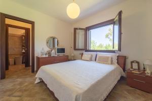 Ένα ή περισσότερα κρεβάτια σε δωμάτιο στο Villa Relax tra i mirti
