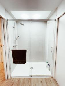 a glass shower in a bathroom with a tub at New Apartament close to IFEMA-AEROPUERTO in Madrid