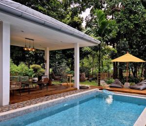a house with a swimming pool and a patio at Villa Tsukino Usagi in Ko Phangan