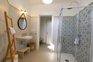 a bathroom with a shower and a sink at Casa Flora - Bed and Breakfast in Torre San Giovanni Ugento