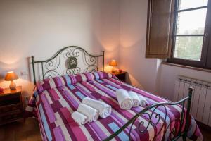 A bed or beds in a room at AGRITURISMO La COLLINA del SOLE