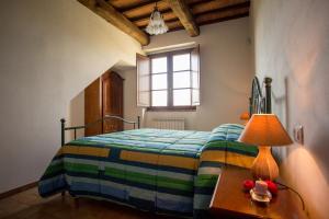 A bed or beds in a room at AGRITURISMO La COLLINA del SOLE