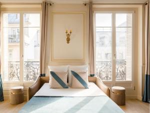 Łóżko lub łóżka w pokoju w obiekcie Merveil - Luxury Suite - Louvre - Opera I