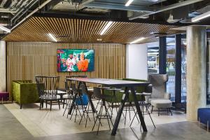 a dining room with a table and chairs at For Students Only Collegiate Eclipse Cardiff in Cardiff
