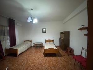 Ένα ή περισσότερα κρεβάτια σε δωμάτιο στο Kledi Apartment