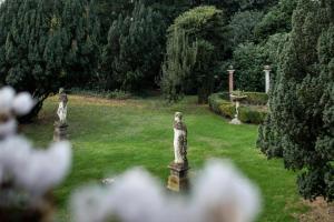 A garden outside Villa Franceschi Hotel & Resort