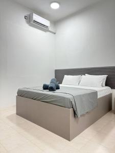 Postel nebo postele na pokoji v ubytování Reinforce Residence