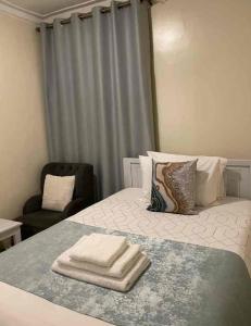 Postel nebo postele na pokoji v ubytování Optimal Home in Nyeri