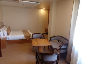 Postel nebo postele na pokoji v ubytování HOTEL HEIGA vns