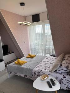 Giường trong phòng chung tại Apartman-Diva-Vukovic
