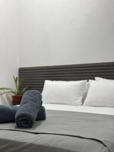 Postel nebo postele na pokoji v ubytování Reinforce Residence