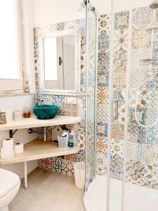a bathroom with a shower and a sink at Suite La TERRAZZA ILLUMINATA in Trapani