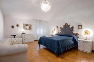 Ένα ή περισσότερα κρεβάτια σε δωμάτιο στο GuestHost - Mare Monti Apartments 1-5-6-8