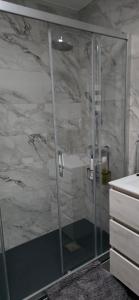 a shower with a glass door in a bathroom at Apartamento Buena Vista in Mojácar +21 photos