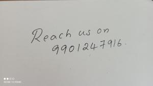 une inscription sur un mur blanc qui dit contactez-nous le octobre dans l'établissement AquaPalace-The heritage homestage, à Champakulam