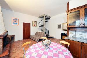 a kitchen with a table and chairs in a room at La Pieve in Decima