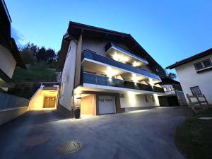 a large house with lights on the side of it at Haus Heimat Wagrain in Wagrain