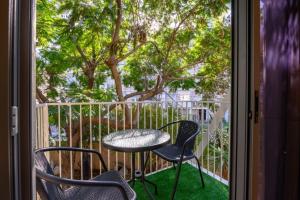 Balkón nebo terasa v ubytování גג החלומות - 4 סוויטות מהממות עם ג'קוזי ספא פרטי בתל אביב