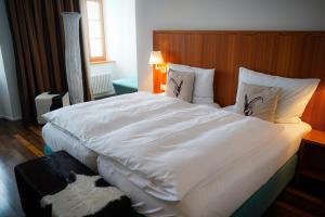 Voodi või voodid majutusasutuse Hotel Pilatus-Kulm toas