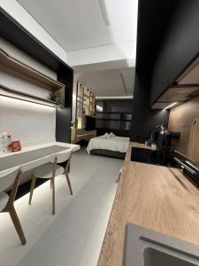 a bathroom with a sink and a bed in a room at Old Town Flat in Patra +44 photos