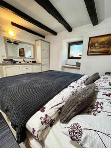 a bedroom with two beds with pillows on it at Apartman Bela in Matulji +12 photos