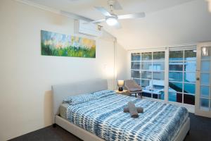 a bedroom with a bed with a teddy bear on it at Facilitated 4 BR House & ICC&Darling Harbour-8 mins walk in Sydney