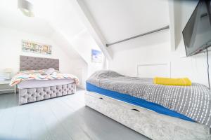 Giường trong phòng chung tại Palace Guesthouse