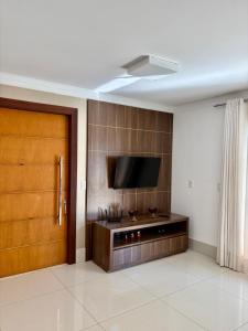 Et tv og/eller underholdning på Apartamento Mobiliado Completo