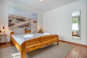 Postel nebo postele na pokoji v ubytování Ferienwohnung Ostseezeit