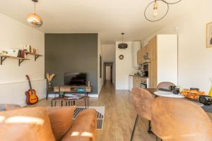 Posezení v ubytování Le Patio - Spacieux T3 avec climatisation et jardin privatif