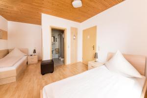 Postel nebo postele na pokoji v ubytování Hotel Bavaria