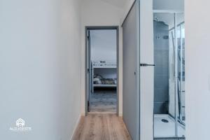 a hallway with a glass door leading to a bedroom at Central Apartment - 2 bedrooms center of Santa Cruz in Santa Cruz +39 photos