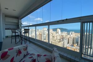 a balcony with a view of the city at SHB - Refinement, Ocean View, Sauna and Pool! in Santos