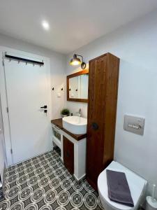 a bathroom with a sink and a toilet at Plane Tree House in Próti +19 photos
