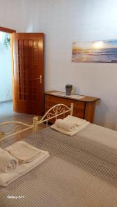 Postel nebo postele na pokoji v ubytování casa fronte mare puro relax